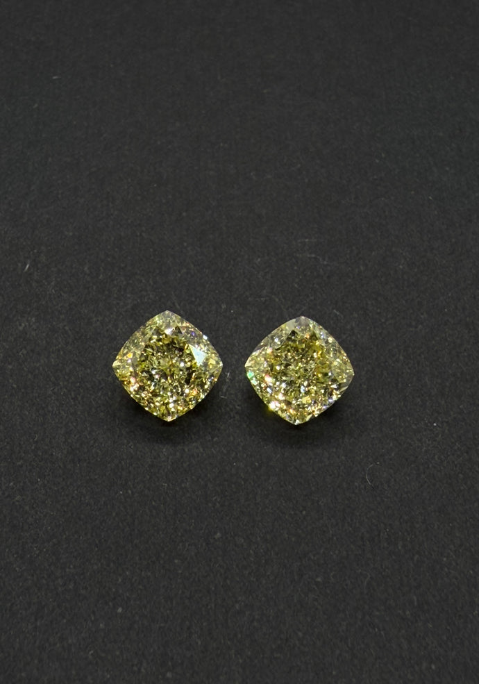 Rare Perfect Matching Pair of Natural Fancy Yellow Diamonds (unmounted)